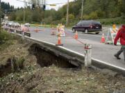 Water from heavy rain over the weekend caused a landslide, undermining a southbound lane of Highway 99 near 112th Street.