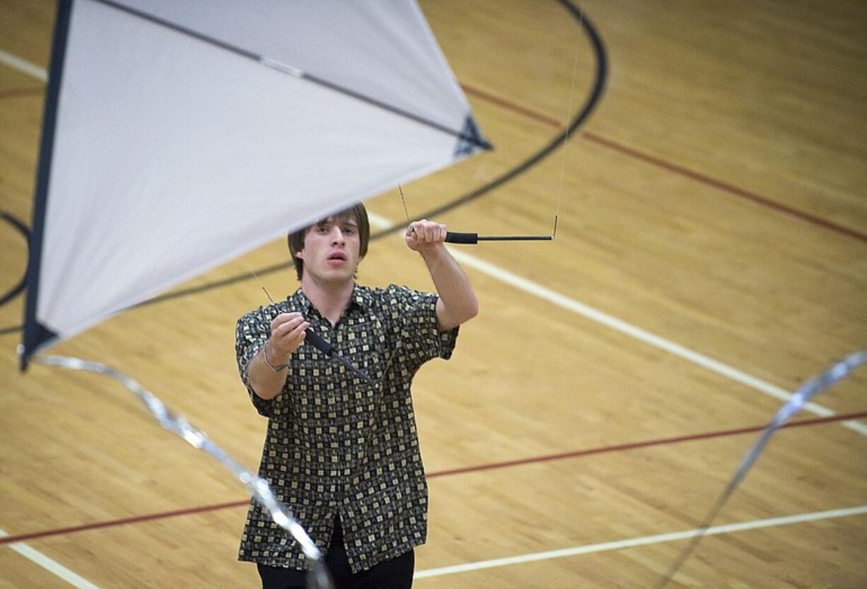 Connor Doran demonstrates indoor kite flying on Sunday.