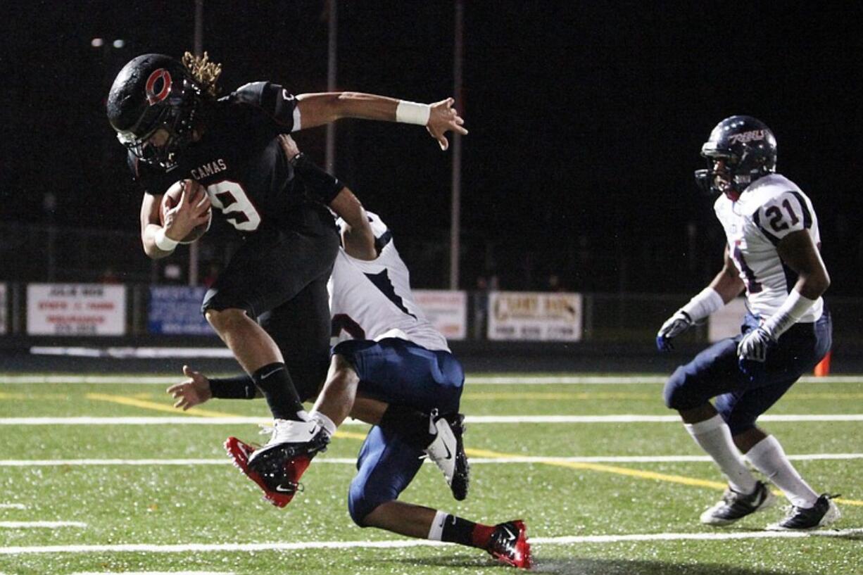 Addison Owen pulls in a 43-yard reception that set up his 7-yard touchdown run for Camas in the first quarter of the Class 3A State playoffs against Juanita of Kirkland.