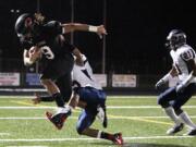 Addison Owen pulls in a 43-yard reception that set up his 7-yard touchdown run for Camas in the first quarter of the Class 3A State playoffs against Juanita of Kirkland.