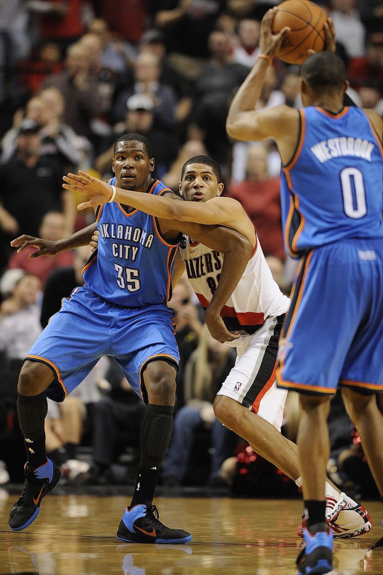 Portland's Nicolas Batum, center, drew praise from NBA All-Star Kevin Durant (35) of Oklahoma City for his defensive play.