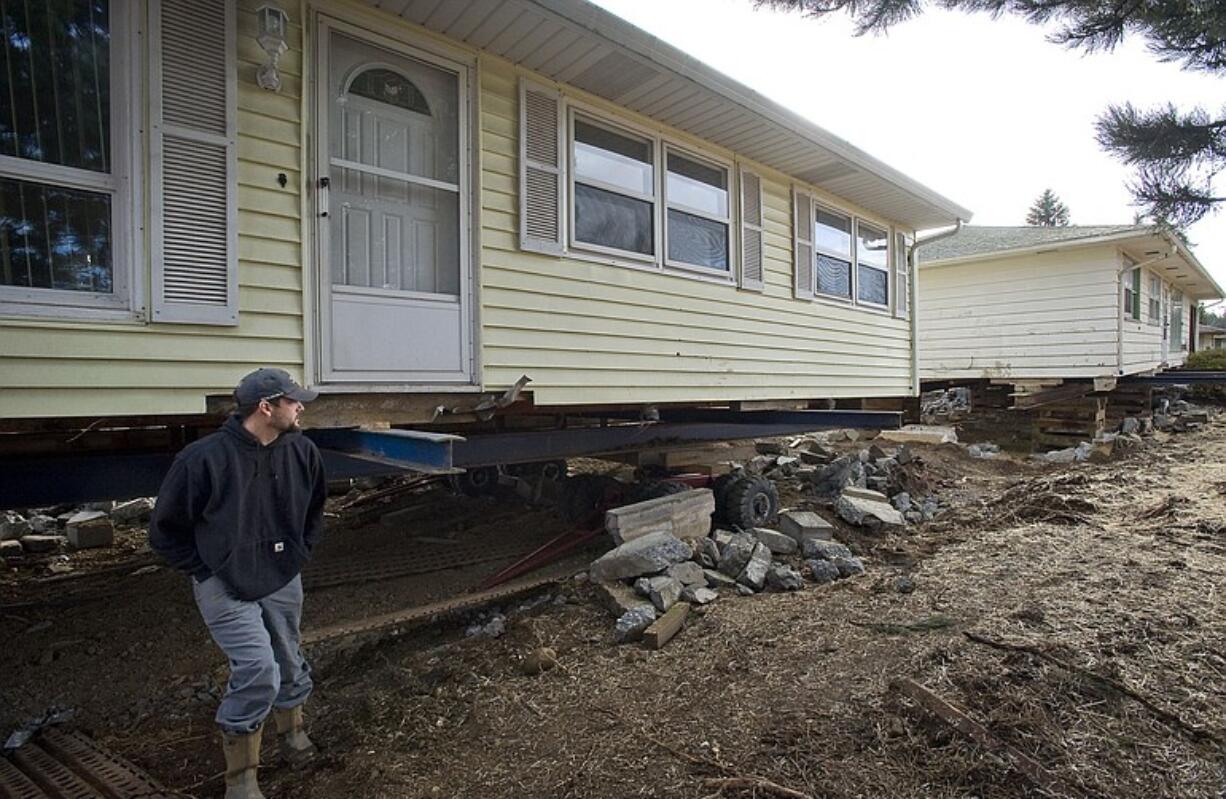 Chris Arsenault heads up a crew that will be responsible for moving 15 Vancouver houses near Southwest Washington Medical Center's main campus to make way for future expansion and a magnet Health and BioScience High School planned for the Evergreen school district.