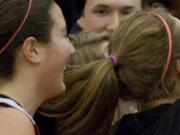 The Camas girls basketball team celebrated a monumental win over Prairie in the district championship game in February.