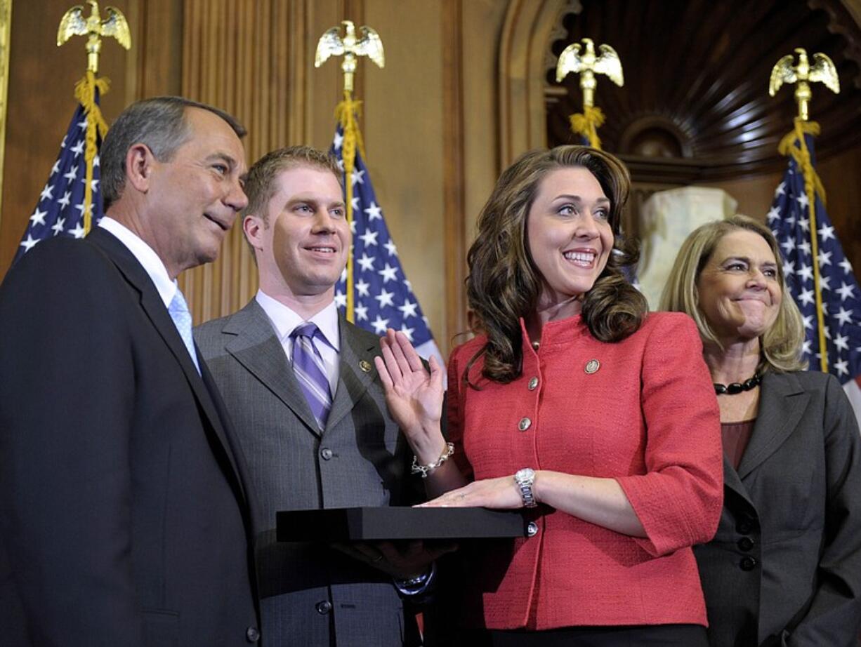 House Speaker John Boehner of Ohio and Rep. Jaime Herrera Beutler, R-Camas, pause for a photo during her ceremonial swearing-in Wednesday in Washington D.C.