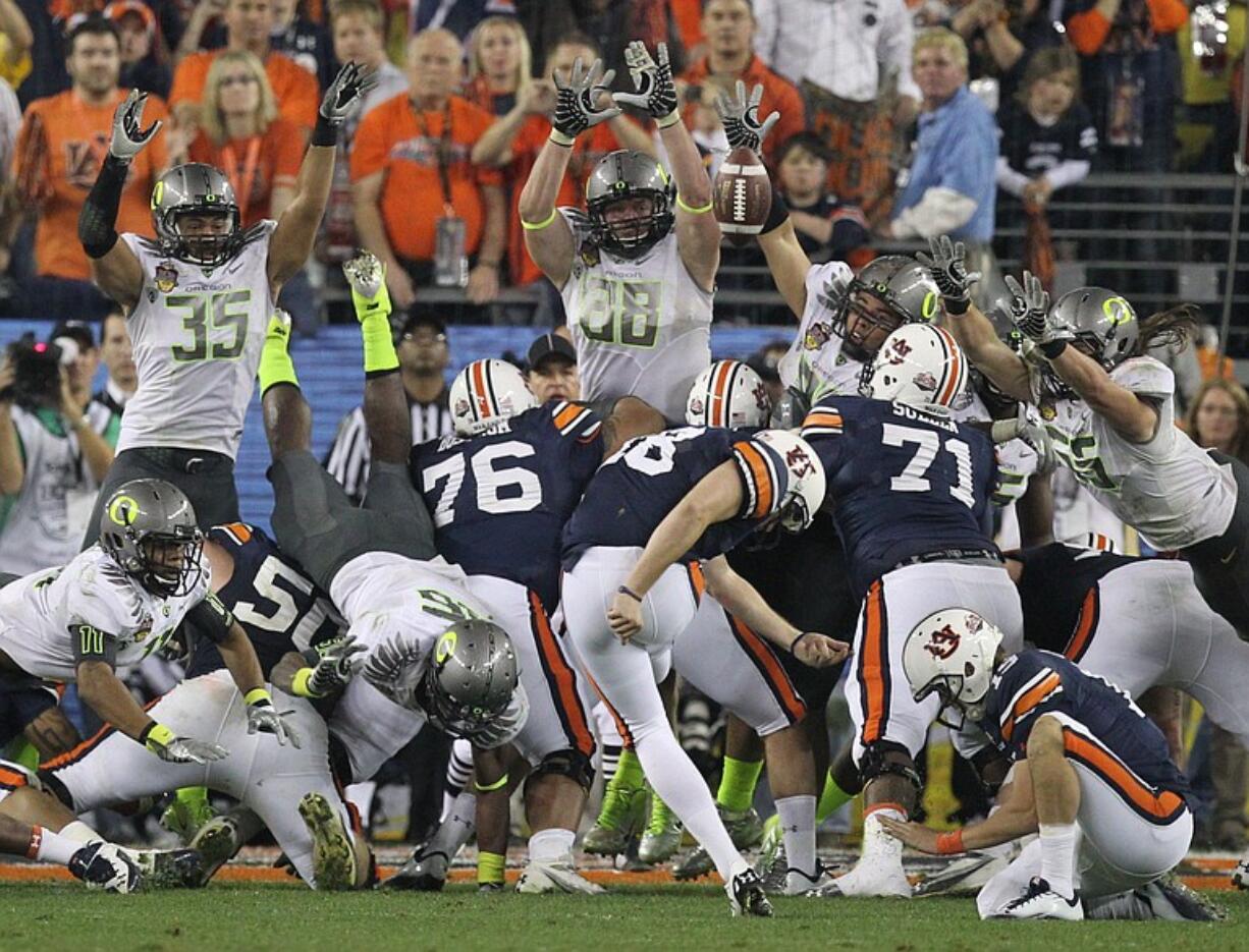 Auburn's Wes Byrum (18) kicks the game-winning field goal late in the second half of the BCS National Championship NCAA college football game against Oregon Monday, Jan. 10, 2011, in Glendale, Ariz. Auburn won 22-19.