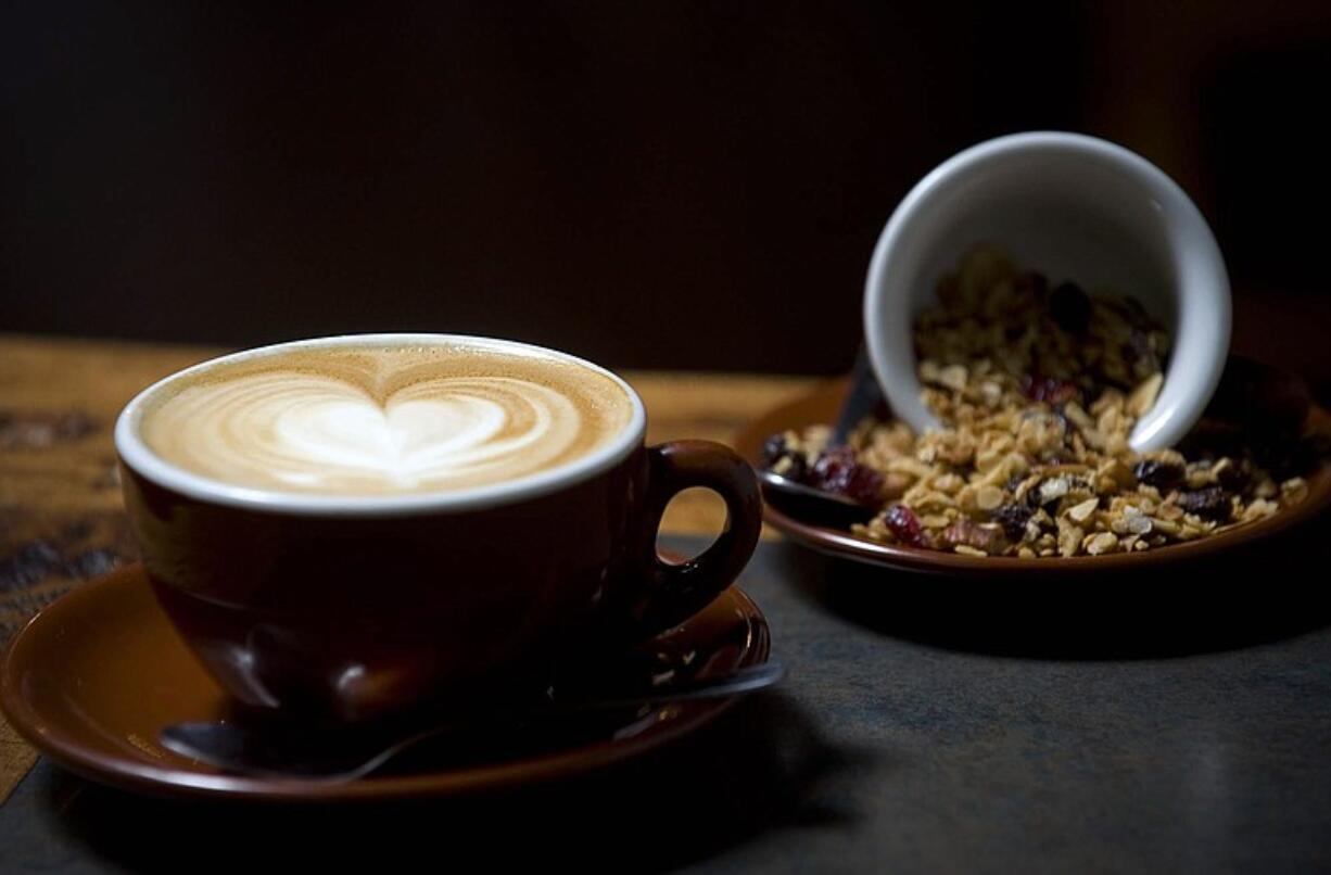 A frothy cappuccino makes a perfect accompaniment to house-made granola at Paper Tiger Coffee Roasters.