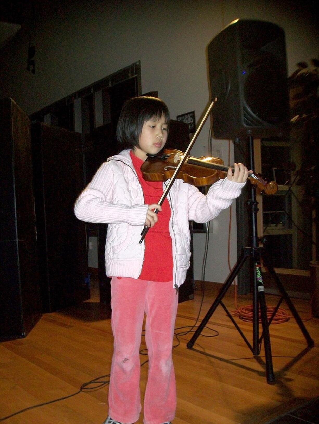 Amy Fan played the violin at The Jack, Will and Rob Boys &amp; Girls Club Holiday Celebration in Camas.