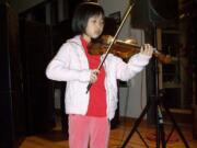 Amy Fan played the violin at The Jack, Will and Rob Boys &amp; Girls Club Holiday Celebration in Camas.