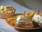 The Philly Cheesesteak sandwich with steak fries and the Antipasto Salad offered at Chuck's Produce &amp; Street Market.