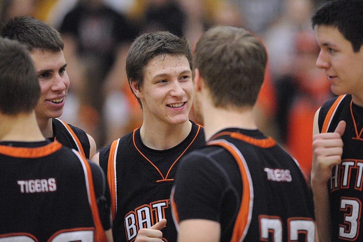 Willie Bratcher of Battle Ground High School, center, encourages teammates before the start of a game against Skyview High School Tuesday January 25, 2011 in Vancouver, Washington.