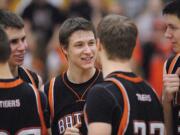 Willie Bratcher of Battle Ground High School, center, encourages teammates before the start of a game against Skyview High School Tuesday January 25, 2011 in Vancouver, Washington.