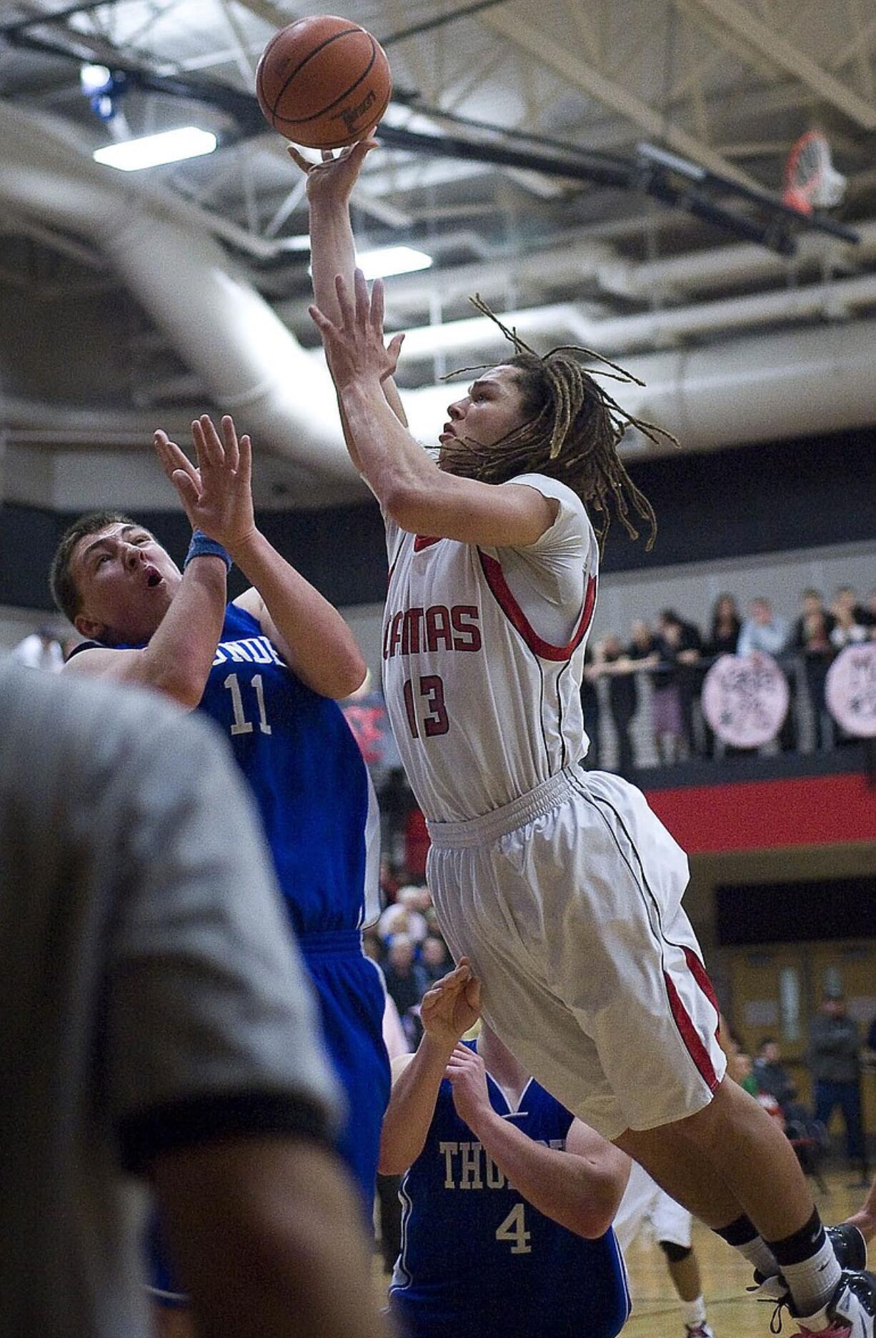 Addison Owen of Camas goes over Mountain View's Ryan Johnson in the second half for two of his eight points.