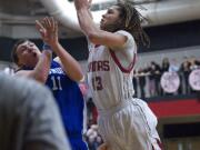 Addison Owen of Camas goes over Mountain View's Ryan Johnson in the second half for two of his eight points.