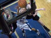 Hockinson's Joshua Hall battles puts up two points past R.A. Long defenders (from left) Sullivan Carter and Tyler VonDracek.