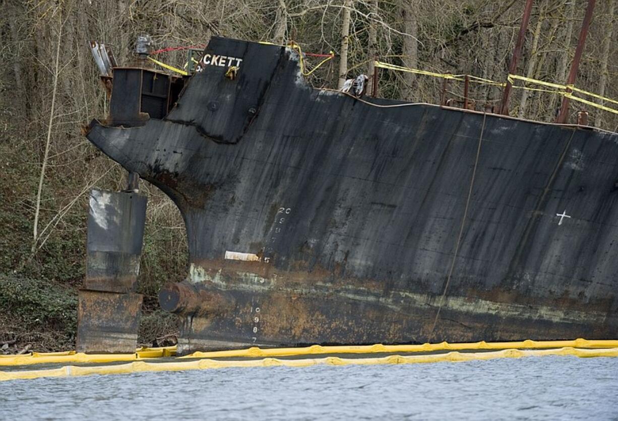 Oil containment booms circle the Davy Crockett Jan.