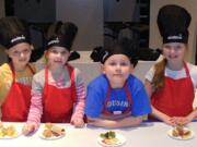 Tukes Valley 4th grader Lynae Merriman, Pleasant Valley 3rd grader Alissa Feeney, Captain Strong 3rd grader Riley Sweeny-Katkansky and Yacolt 4th grader Julie Koskiniem show off their creations Feb.