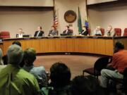 Vancouver City Councilmembers, from left, Pat Campbell, Jack Burkman, Bart Hansen, Mayor Tim Leavitt,  Jeanne Harris, Jeanne Stewart and Larry Smith listen to a speaker during a city council meeting July 12, 2010, at City Hall in Vancouver.