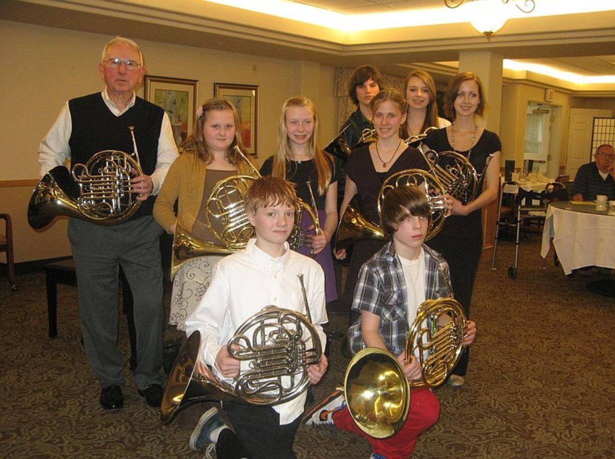 Paul Walden's music students gave a recital for residents of Glenwood Senior Living. Kneeling left to right: Jeren Olson and Joseph Bagdovitz. Second row: Walden, private teacher; Hannah Kellogg, Claaire Kellogg, Katarina Kubiniec.