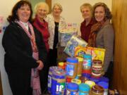 Soroptimist International of Camas-Washougal club members deliver peanut butter and food to the East County Family Resource Center.