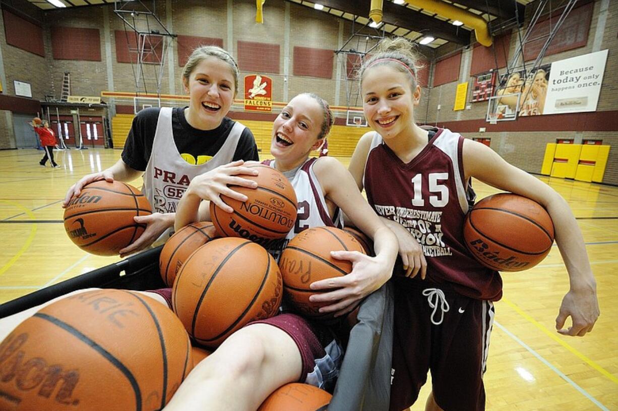 Cori Woodward, left, Megan Lindsley and Jackie Lanz, right, photographed Monday February 28, 2011 in Vancouver, Washington, have stepped up as sophomores to help the Prairie girls basketball team make it to the 3A WIAA State Basketball playoffs at the Tacoma Dome this weekend.