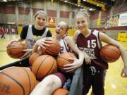 Cori Woodward, left, Megan Lindsley and Jackie Lanz, right, photographed Monday February 28, 2011 in Vancouver, Washington, have stepped up as sophomores to help the Prairie girls basketball team make it to the 3A WIAA State Basketball playoffs at the Tacoma Dome this weekend.