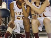 Prairie's Lynn Idelberger, right, wipes a tear away from the face of teammate Lanae Adams. Adams left Friday's game with a sore knee and did not return.