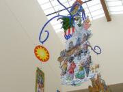 &quot;Wings Around the World&quot; mobile by Seattle artist Terry Furchgott hangs in Chief Umtuch Middle School in Battle Ground.