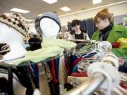 Customers Brianne Stoner, 16, left, and her mom, Shari Stoner, shop at the new Second Chance Thrift Store on St.