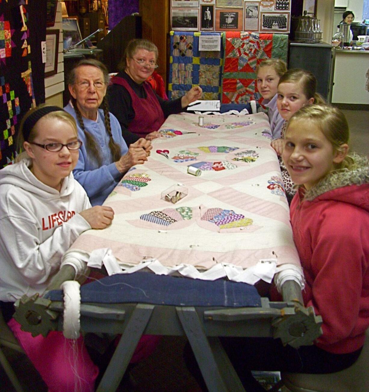 Barbara Sizemore demonstrates the art of hand-quilting at the North Clark Historical Museum Annual Quilt Show.