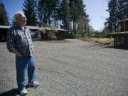 Darrel Santesson stands in his newly acquired property across the street from where he and his wife, Norma, have lived for the past 36 years.