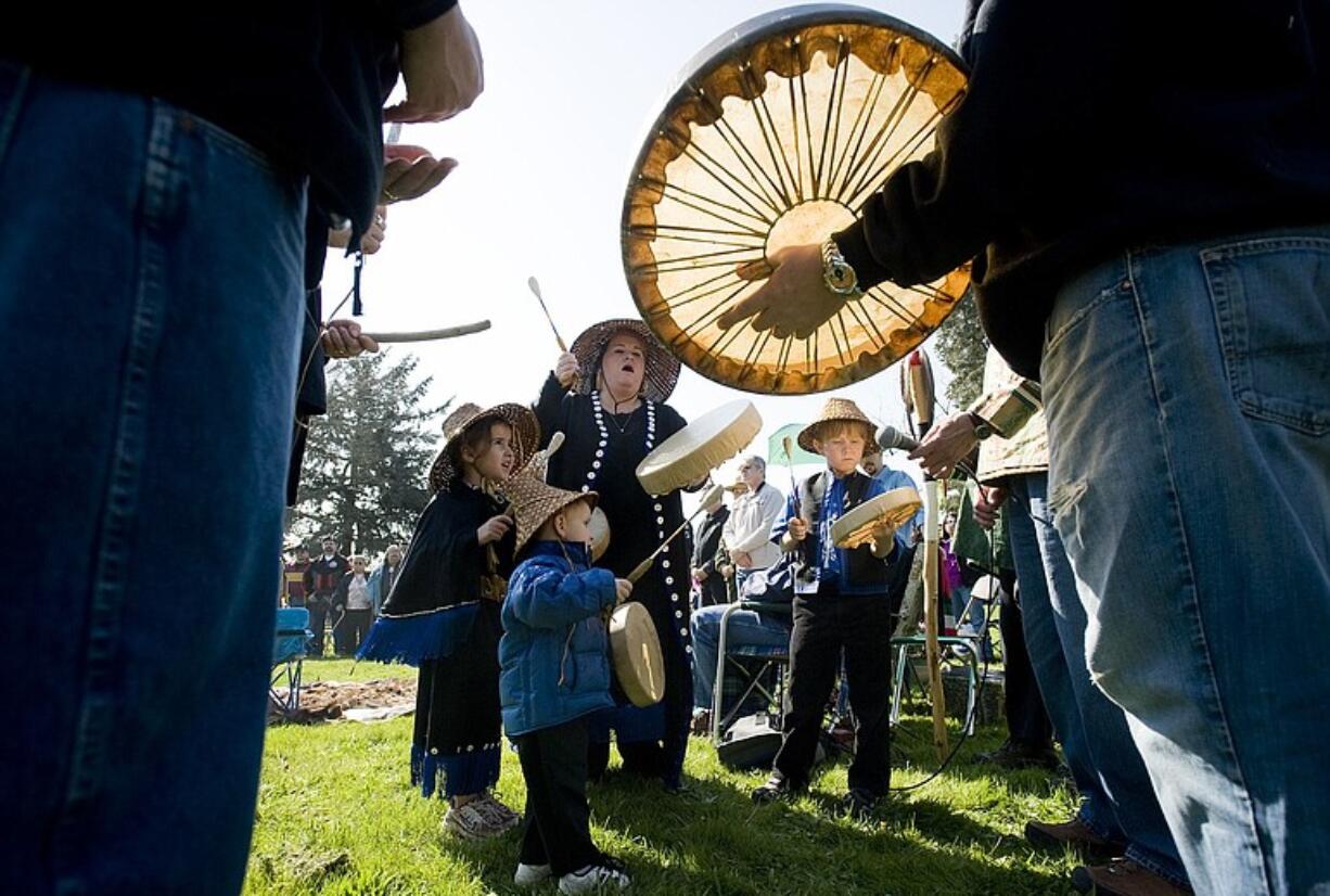 Cowlitz tribe members perform an Eagle Welcome Song to start the 14th annual Chief Redheart Memorial Ceremony at the Fort Vancouver National Site on Saturday.