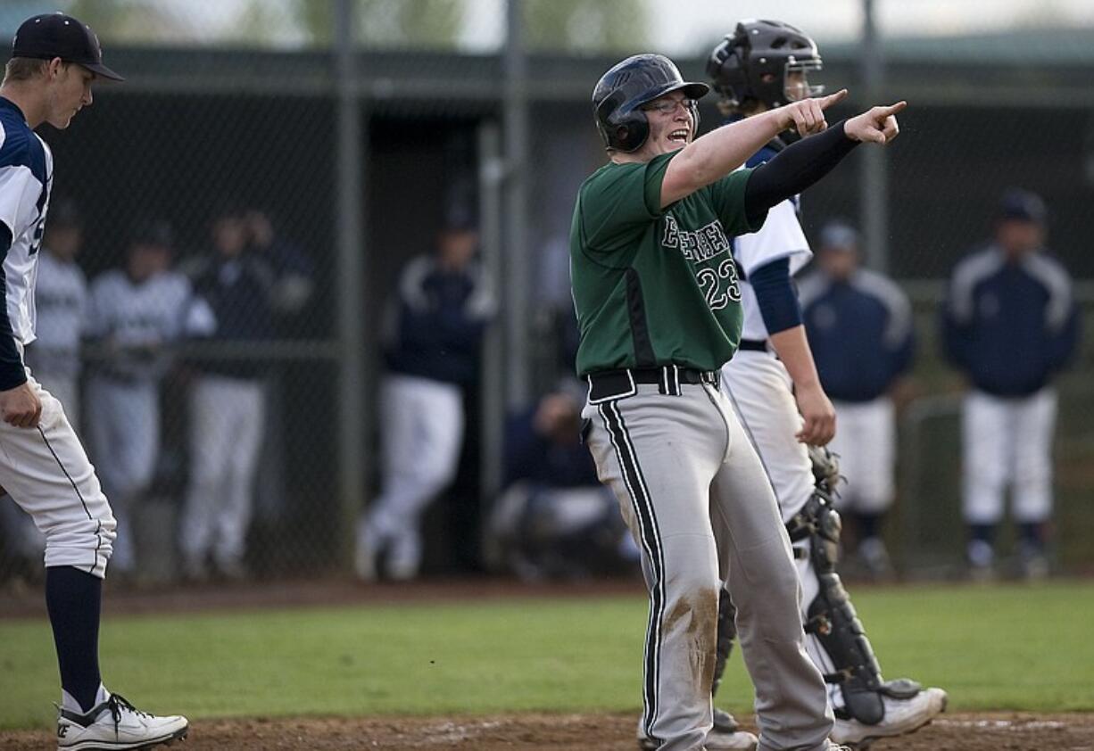 Evergreen's Will Pecson points toward teammate Zach Smith who drove him home with a single during an Evergreen sixth inning rally against Skyview on Thursday.