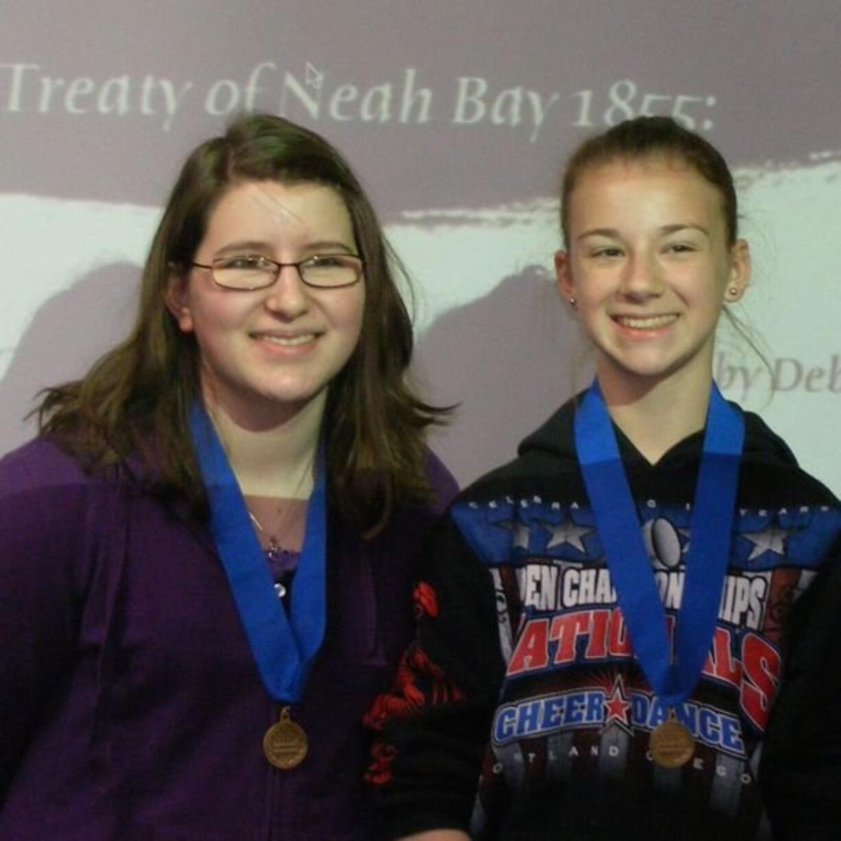 Jessi Shelton, left, and Mercedes McLeod of Pleasant Valley Middle School won the Group Documentary division for middle school and junior high students at Washington History Day on May 7 in Bellevue.