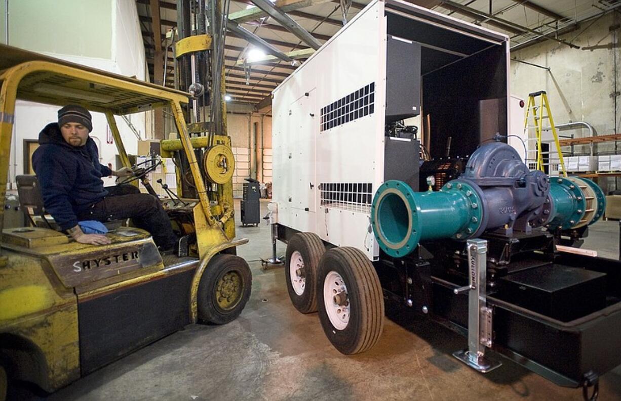 Kyle Kasting, assembly mechanic for Premier Pump &amp; Power, drives a forklift.