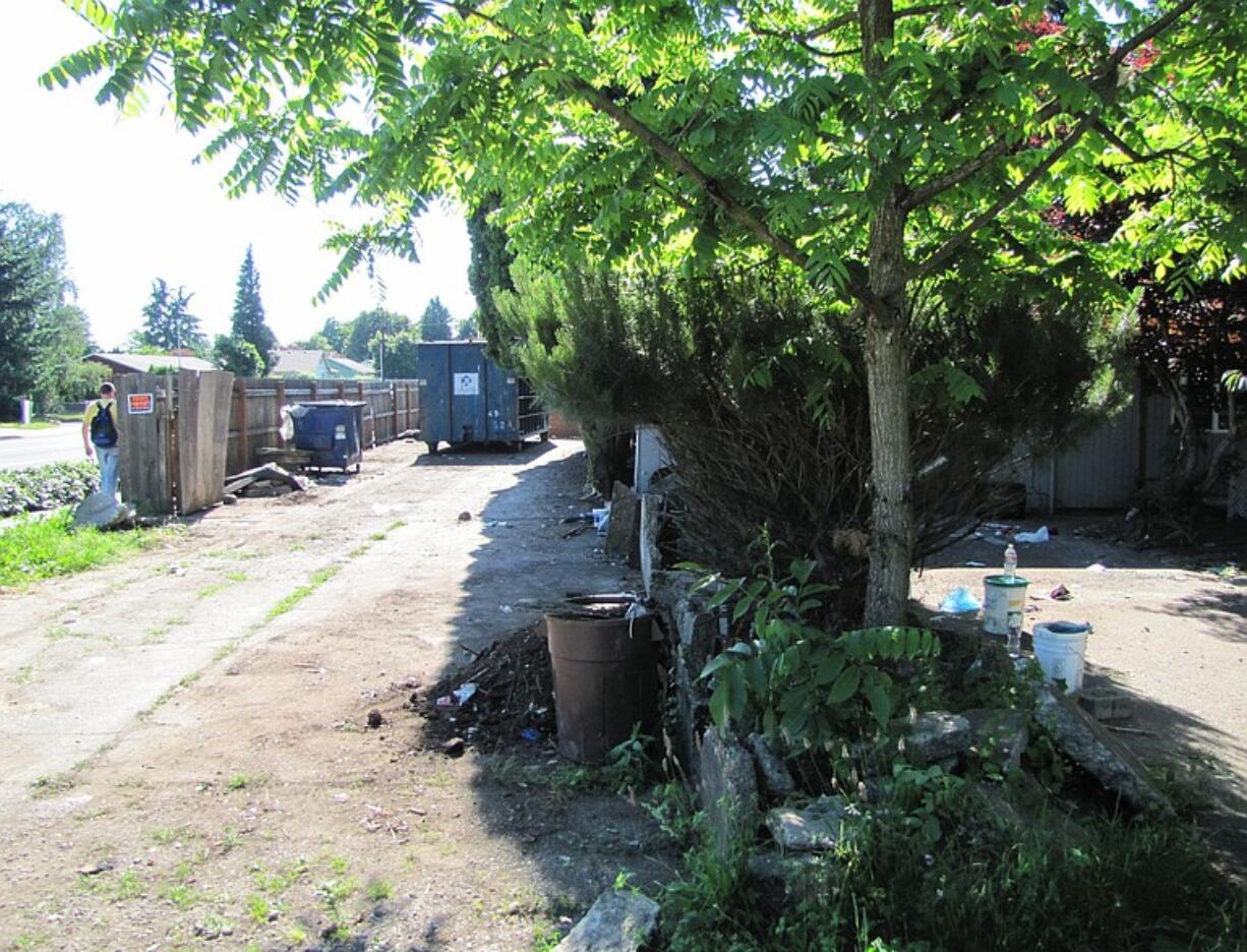 A cleanup has begun at this Sifton foreclosure home where squatters accumulated garbage for years.