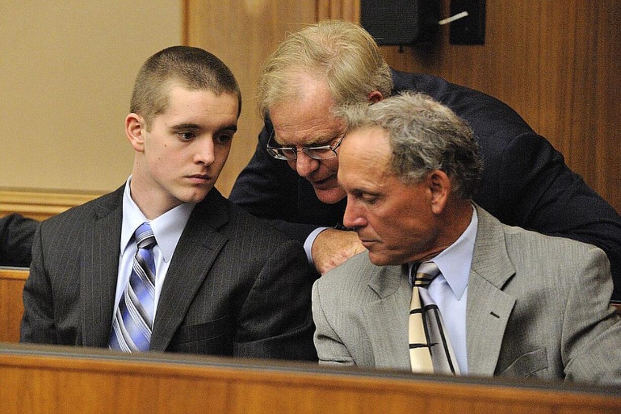 Anthony Bittner, left, consults with his attorneys, Thomas Phelan, center, and Steven Myers, right, before pleading guilty Thursday to attempted residential burglary and possesion of stolen property.