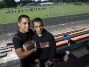 Miguel Salamanca, left, who will play in the Freedom Bowl Classic that raises money for the Shriners Hospital, poses with his brother Roy.