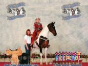 Kathy Howe Drysdale, a trainer from Portland, stands by Angela Burckhard and her award-winning horse Class Dismissed.