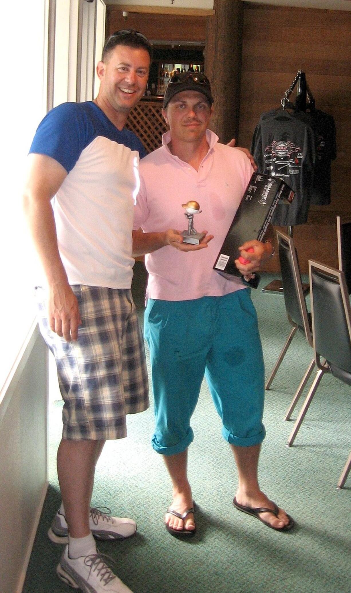 Captain Scott Johns, left, and Firefighter-Paramedic Scott Squires won the worst dressed and shortest drive awards during the Bob Allen Memorial Golf Tournament.