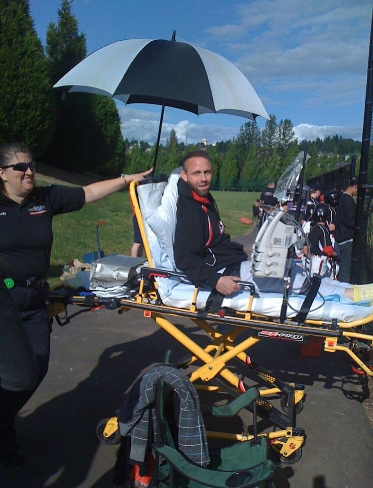 Jim Orr, who is battling cancer, is transported to his JBO team's game in Camas via ambulance.