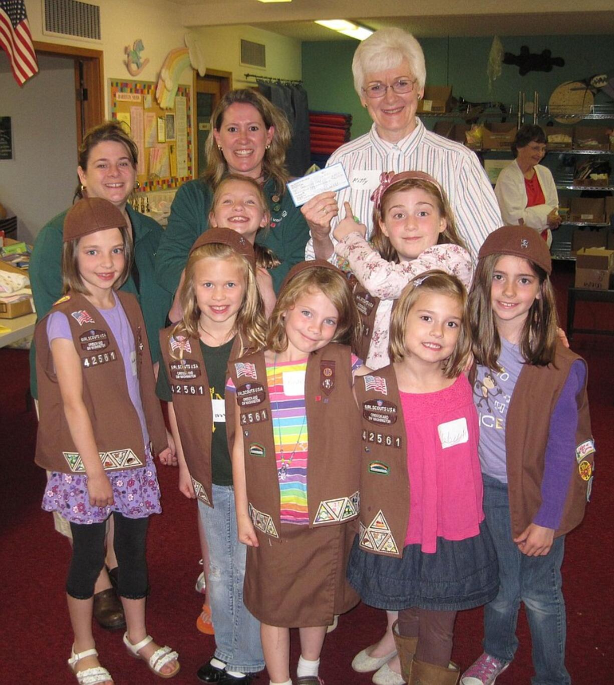 Girl Scout Brownie Troop 42561 donated $255 to Babies in Need. Back row, leaders Amy Surface and Libby Odren, and Director of Babies in Need Kitty Ash.