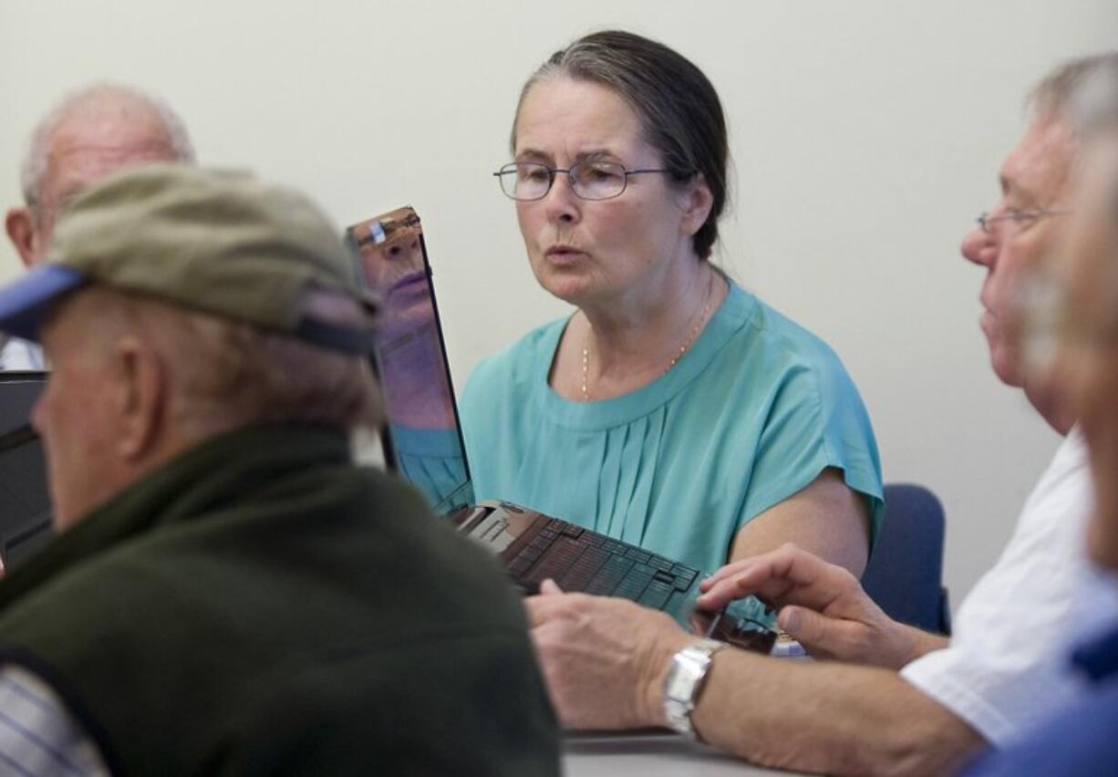 Patricia Halverson of Vancouver learns to attach photographs to emails during a computer club meeting for seniors at the Firstenburg Community Center last week.