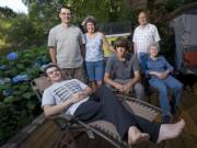 Loren and Laurie Sickles, back left, and their two sons, Caleb, 17, foreground, and Brandon, 14, center, moved in with Loren's parents, Larry, 75, and Lois Sickles, 70, right, after Loren lost his job and the family was forced to sell their home.