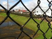 A landscaping truck sits parked near an area around a stormwater pond being built near Northeast Tenney Road and Northeast 139th Street in Salmon Creek.