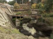 A remote video camera captures the force of a massive explosion as it breaches Condit Dam shortly after noon Wednesday, releasing the White Salmon River for the first time since the dam was built in 1913.