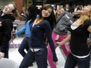 Heritage High School dance students with Jerica Pinard, center, is part of a &quot;flash mob&quot; performance of Michael Jackson's &quot;Thriller&quot; during lunch Friday. It was a promotion for Saturday's 7 p.m.