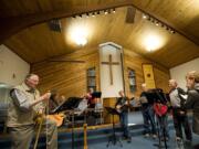 Feeling the spirit: This praise group from the St. John the Evangelist Catholic Church is getting ready for a multichurch concert that will benefit the seasonal Winter Hospitality Overflow response to homelessness.