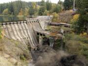 The Condit Dam is breached Oct. 26. Sediment, debris and logs that were backed up behind the dam are creating jams on the White Salmon River that could pose a threat to people.