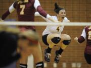 Prairie's Katie Pagel (4) celebrates with her teammates after beating Camas for the district volleyball championship on Tuesday.