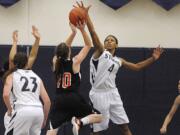 Skyview's Jocelyn Adams (4) blocks a shot by Battle Ground's Tessa Vanderpool (10) during Friday's 4A Greater St. Helens League contest.